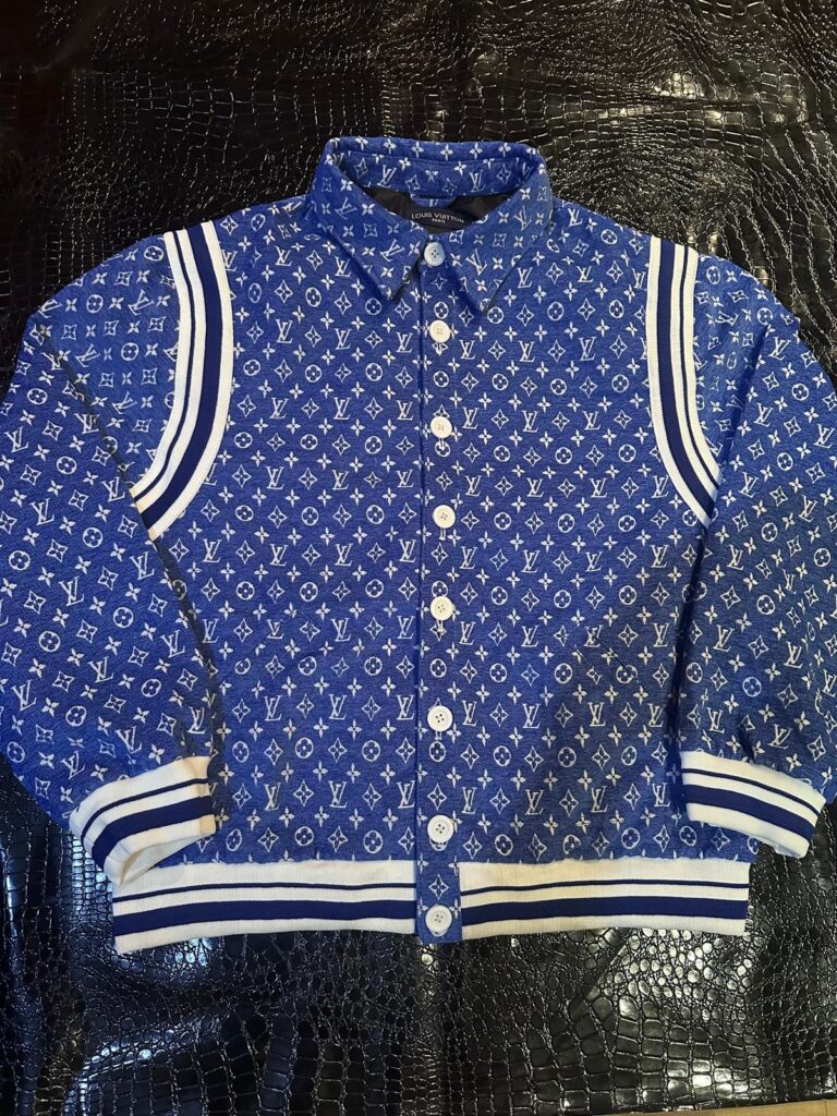 Louis Vuitton Signature Varsity – Custom Leather Jacket featuring a Light blue leather jacket sleeve design and 3D monogramming by The White Widow Leather.