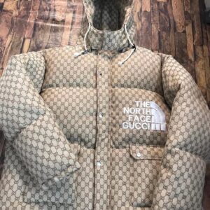 The North Face x Gucci Monogram Puffer puffer with GG logo print and high-loft insulation by The White Widow Leather.