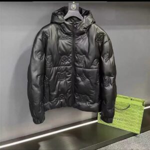 Black hooded Customized Leather Jacket with all-over embossed monogram pattern and puffer styling.