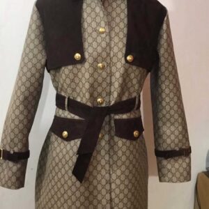 Customized Leather Jacket with brown leather panels, gold buttons, belt waist detail and monogram patterned body displayed on mannequin
