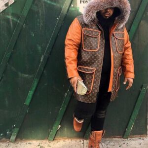 A heavy-duty Customized Leather Jacket parka featuring leather sleeves and an oversized fur-trimmed hood.